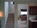 From the kitchen, looking back out to the living/dining room and up the stairs (29KB)